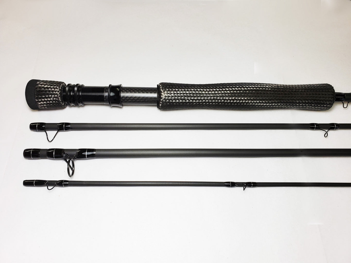 WE HAVE JUST ADDED A NEW LINE OF FLY RODS. THIS ONE IS A FAST ACTON 9FT 4PC 11WT RAW CARON FIBER WITH A CARBON FIBER REEL SEAT , GRIP AND FIGHTING BUTT